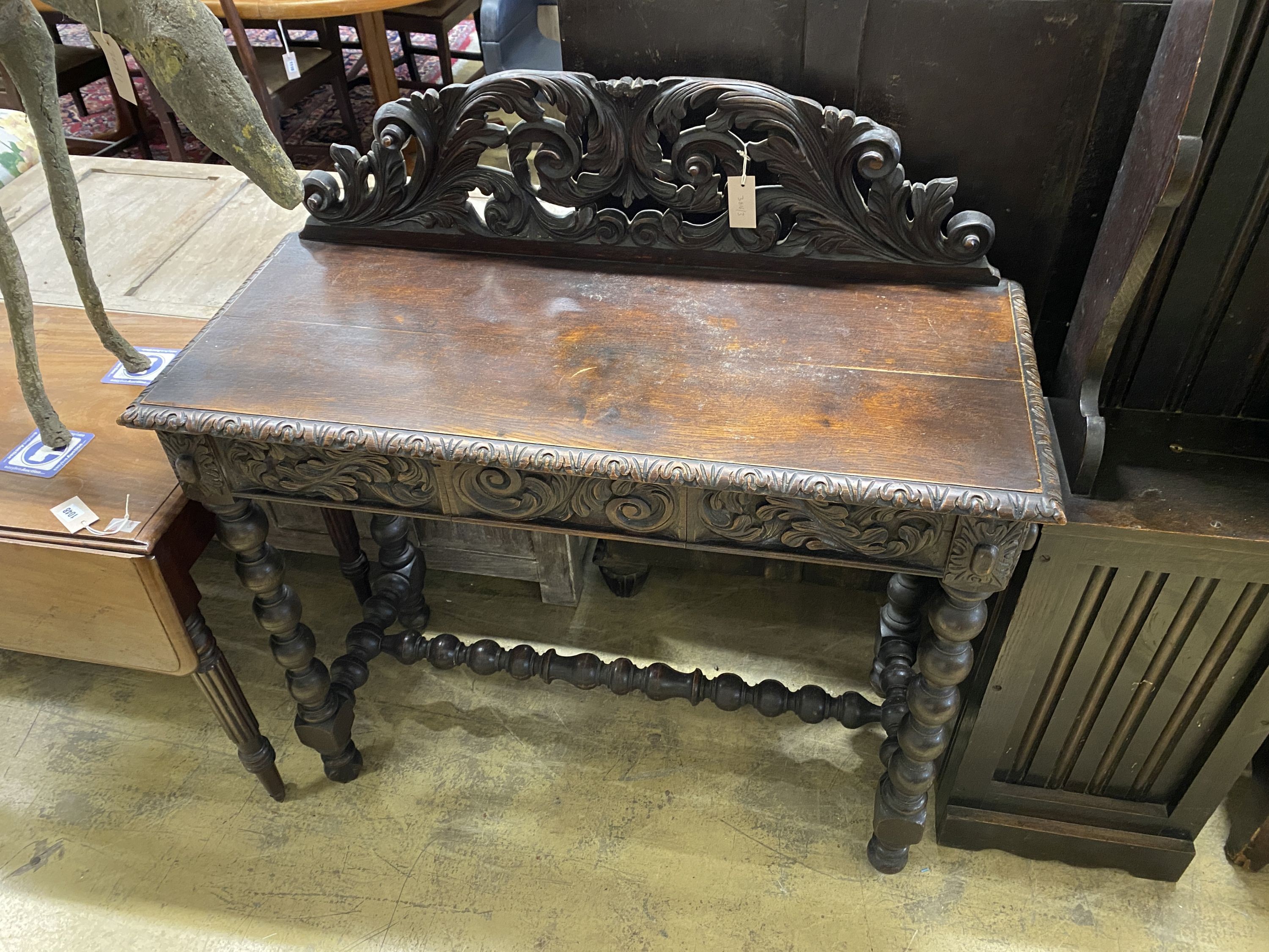 A Victorian carved oak console table, width 106cm, depth 45cm, height 111cm